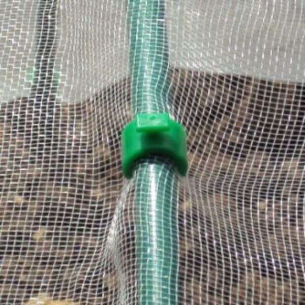 A close-up of a green hoop clip