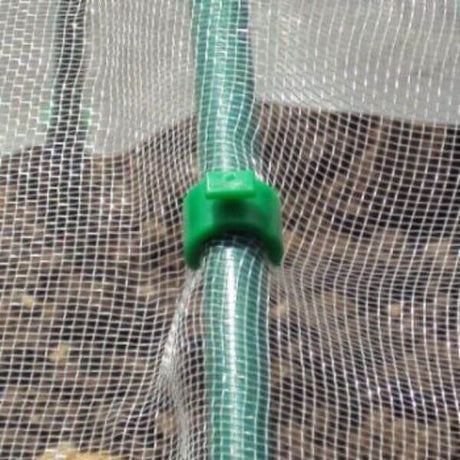 A close-up of a green hoop clip