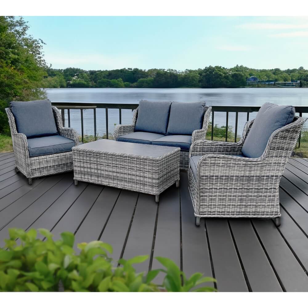 rattan garden furniture by lake