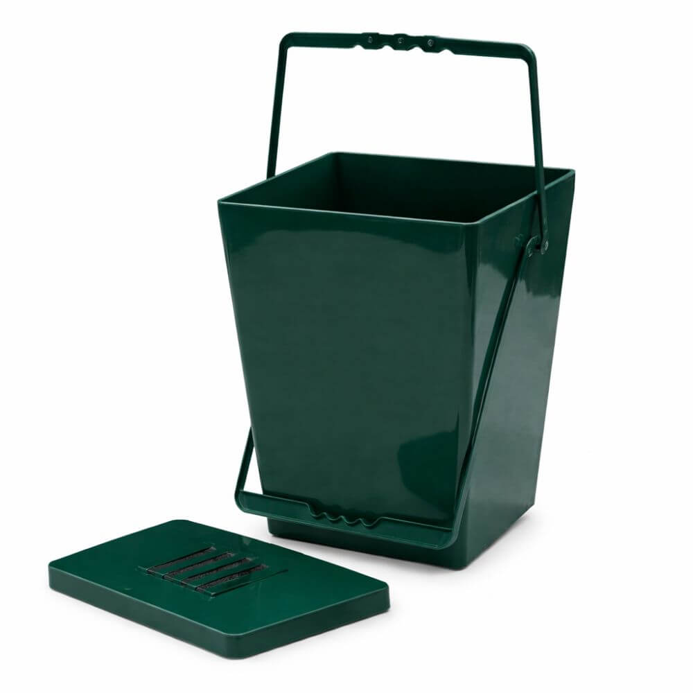 Green kitchen compost bin with a lid on a white background
