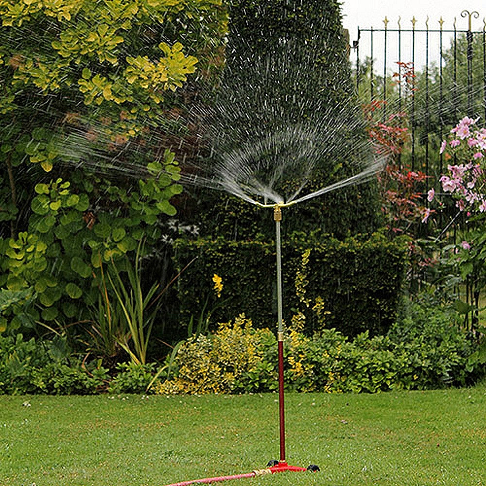 Darlac Garden sprinkler and riser spraying water in a garden