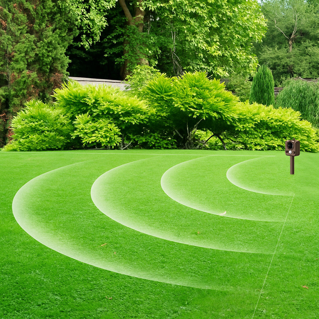Fox Repeller in use on a green lawn with trees