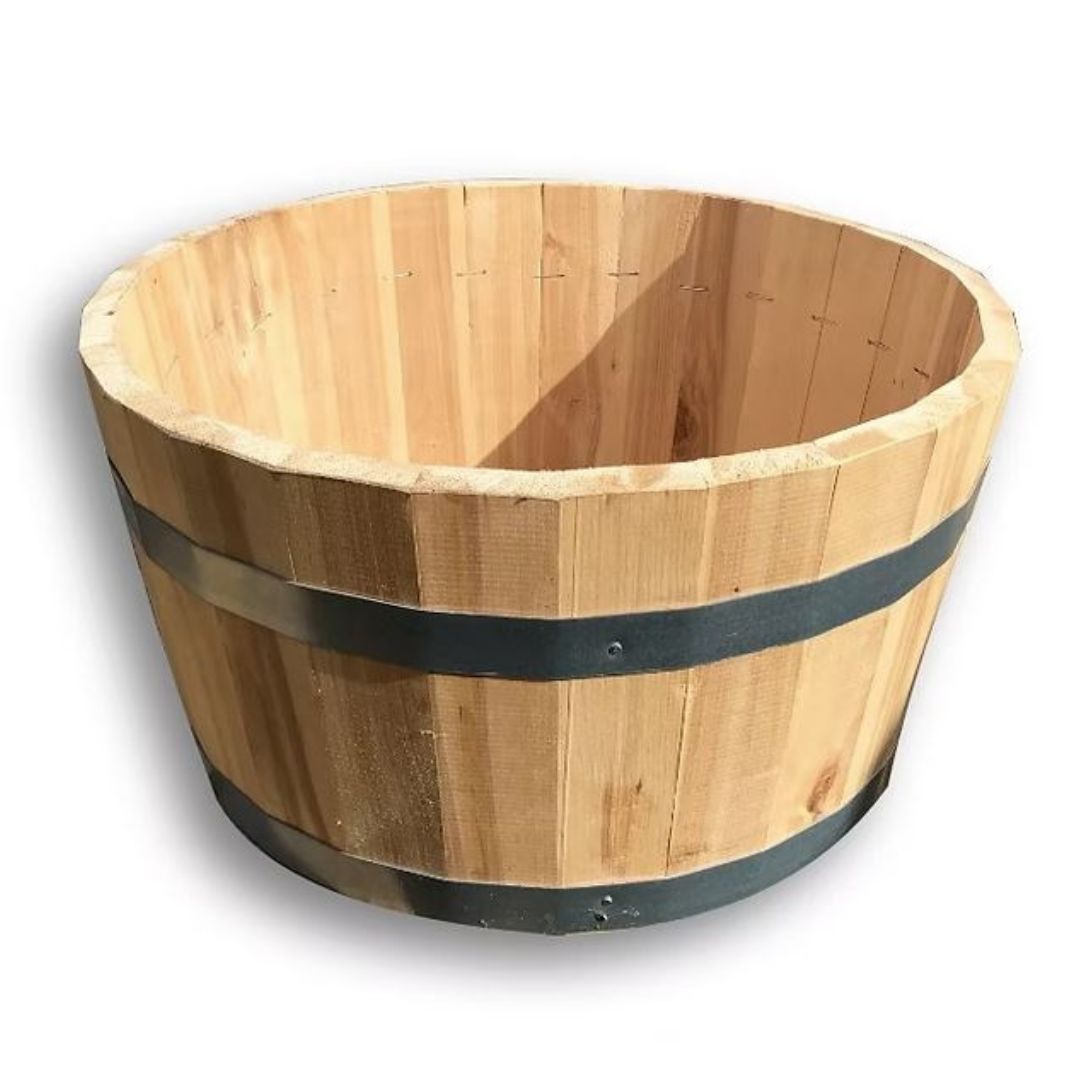 Wooden barrel with a black band on a white background