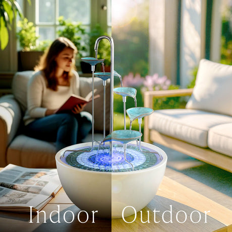 Futuristic water fountain with 'Indoor' and 'Outdoor' labels in a living room setting.