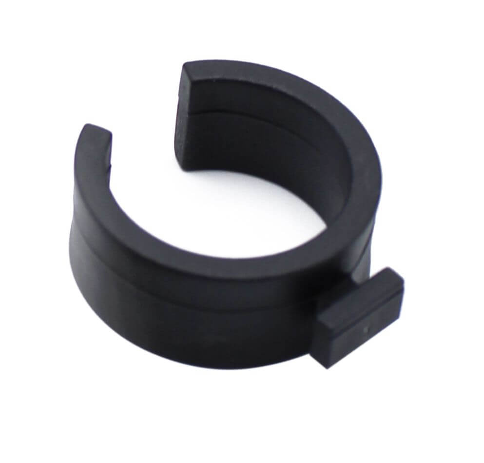 Black plastic clip for securing netting to aluminium poles on a white background
