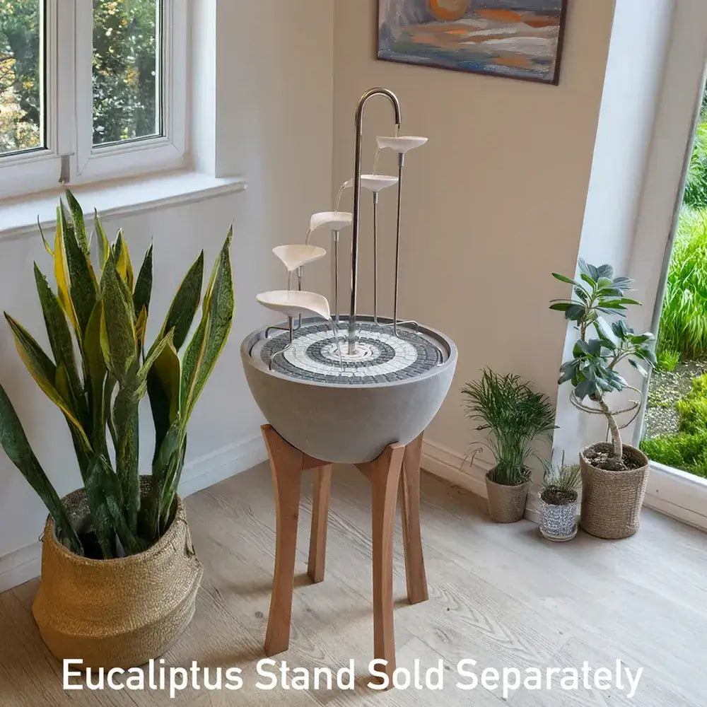 Decorative indoor fountain with plants in a room setting