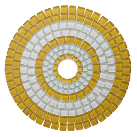 Round mosaic coaster with yellow and white tiles on a white background