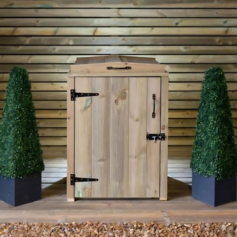 single wooden rustic bin storage cupboard with 1 door and black hinges on decking