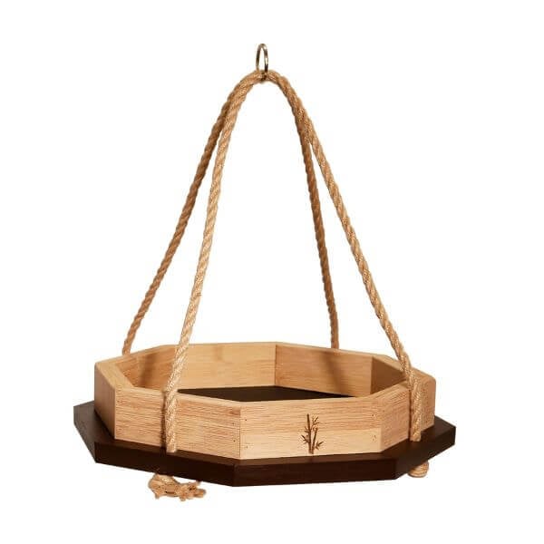 A hanging bamboo octagon platform bird feeder with a jute rope and a dark brown trim.
