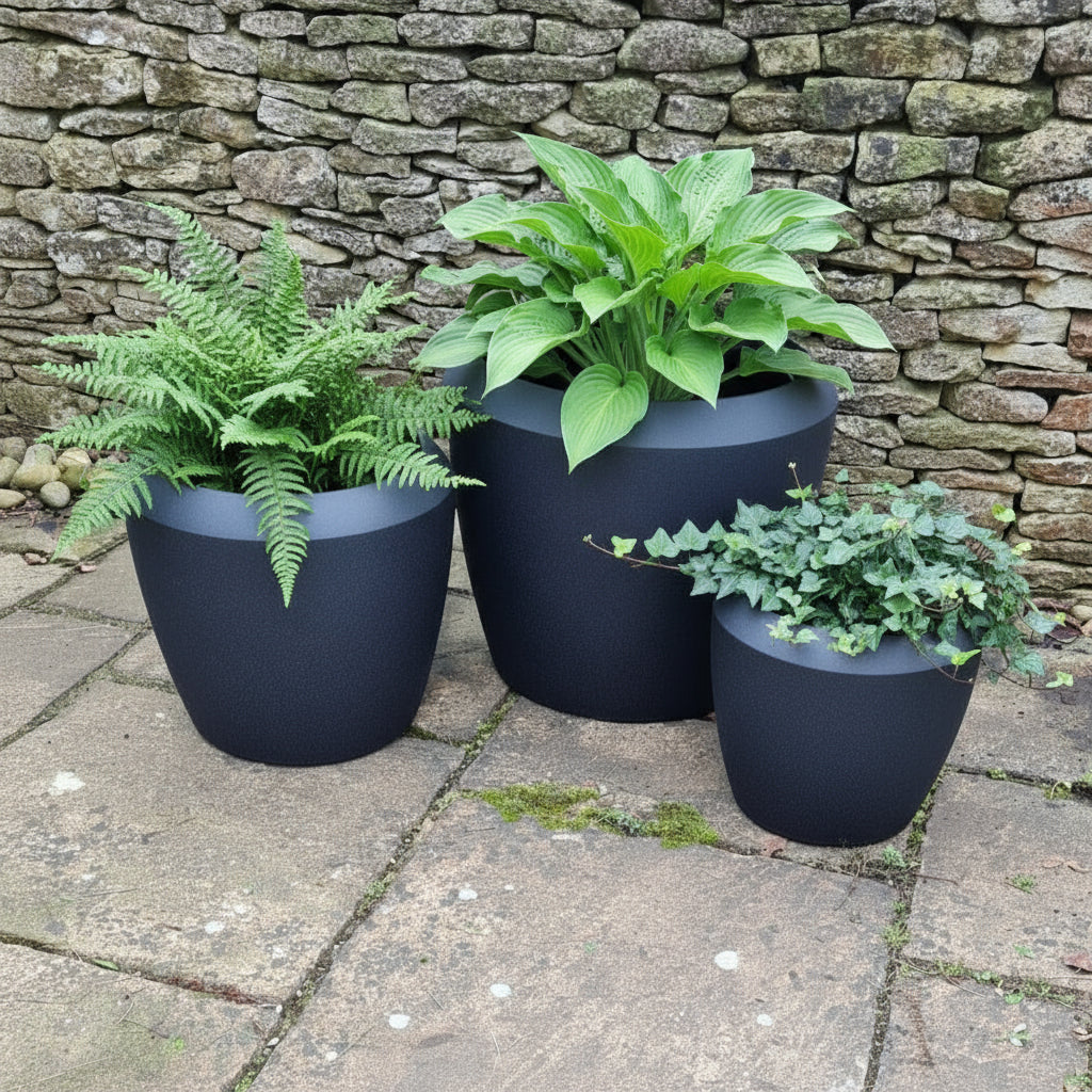 black castille planter set on patio with uk plants in them