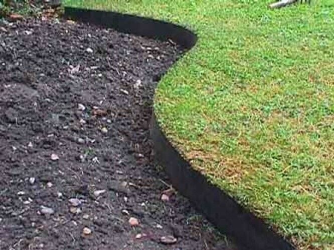 dug out border edging against green lawn