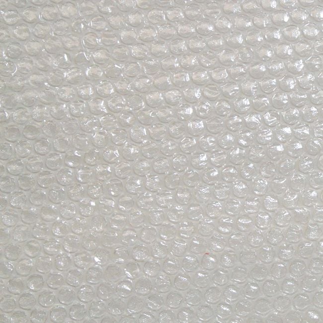 Close-up of a white bubble wrap used for greenhouse insulation.
