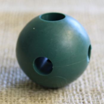A green ball with holes in for making garden cages with bamboo or metal