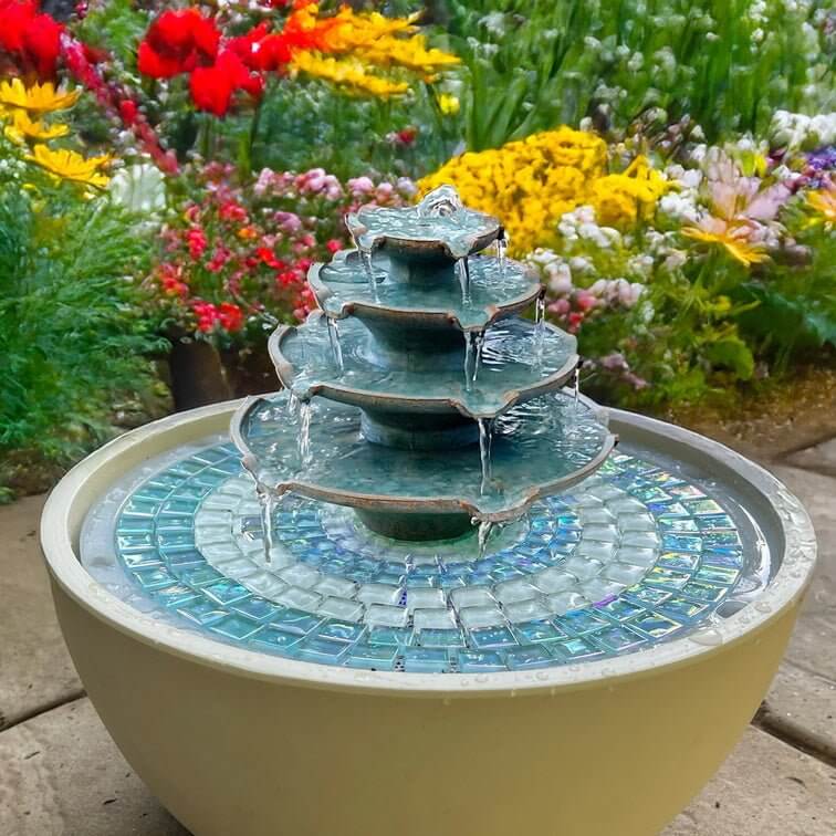 garden fountain with mosaic base