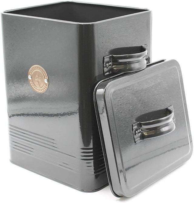 A black metal cat food tin with a lid and a metal rose gold tag on the front featuring a small cat picture and the text 'cat'.