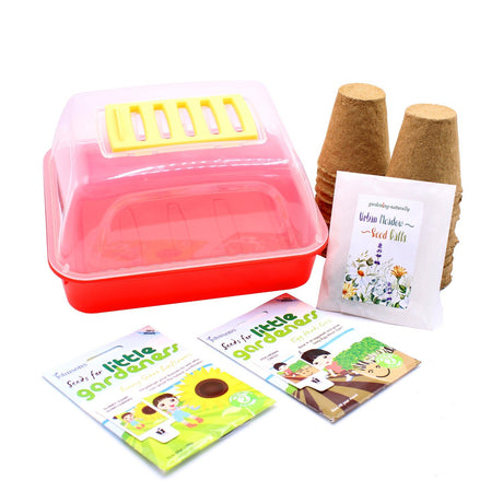 Children's gardening gift set including a red plastic propagator, wooden fibre pots, and packets of flower seeds.