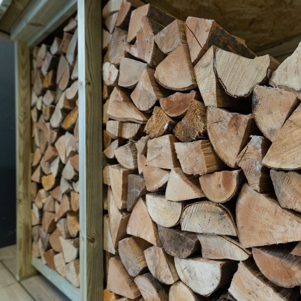 Side view of full log storage cabin