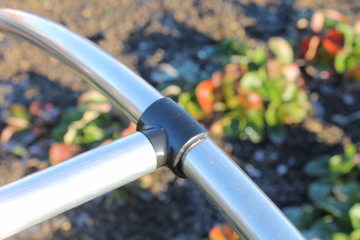 Black connector support bar on a garden cage close up