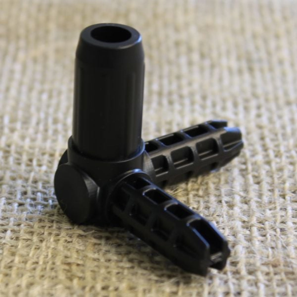 A black plastic corner joiner for fruit and vegetable cages