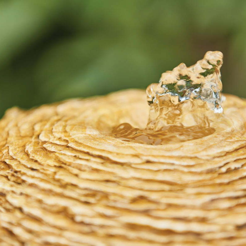 sun shape water fountain close up image