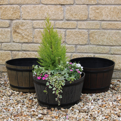 wooden effect barrel planter in garden set