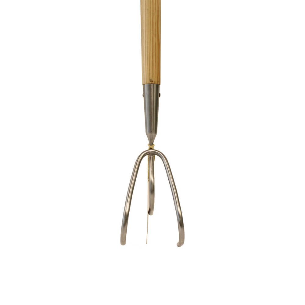 Metal garden cultivator with wooden handle on a white background
