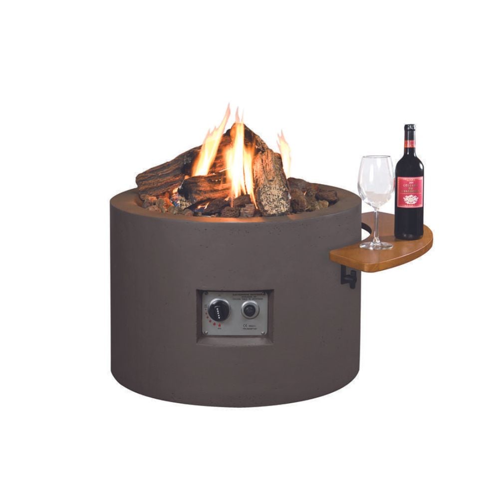 A cylindrical fire pit with a glass bottle and a bottle of wine, creating a cozy ambiance for outdoor gatherings.