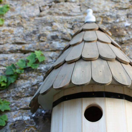 dovecote house white with wooden roof