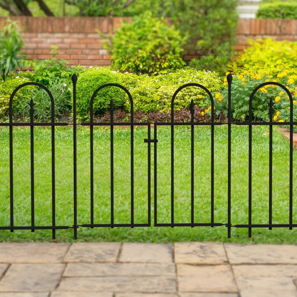 metal fence panels between a path and grass