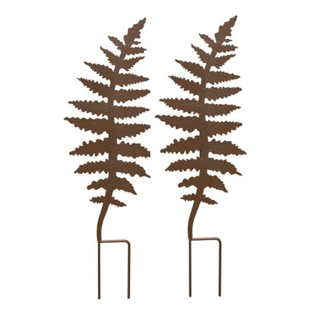 A rust-colored, fern leaf-shaped plant support with a double-legged base.