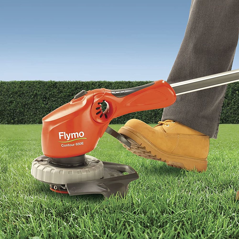 flymo strimmer showing foot peddle