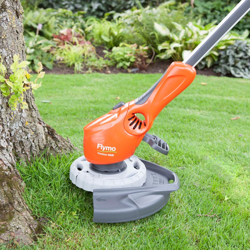 strimmer showing how close it can get to garden objects like trees