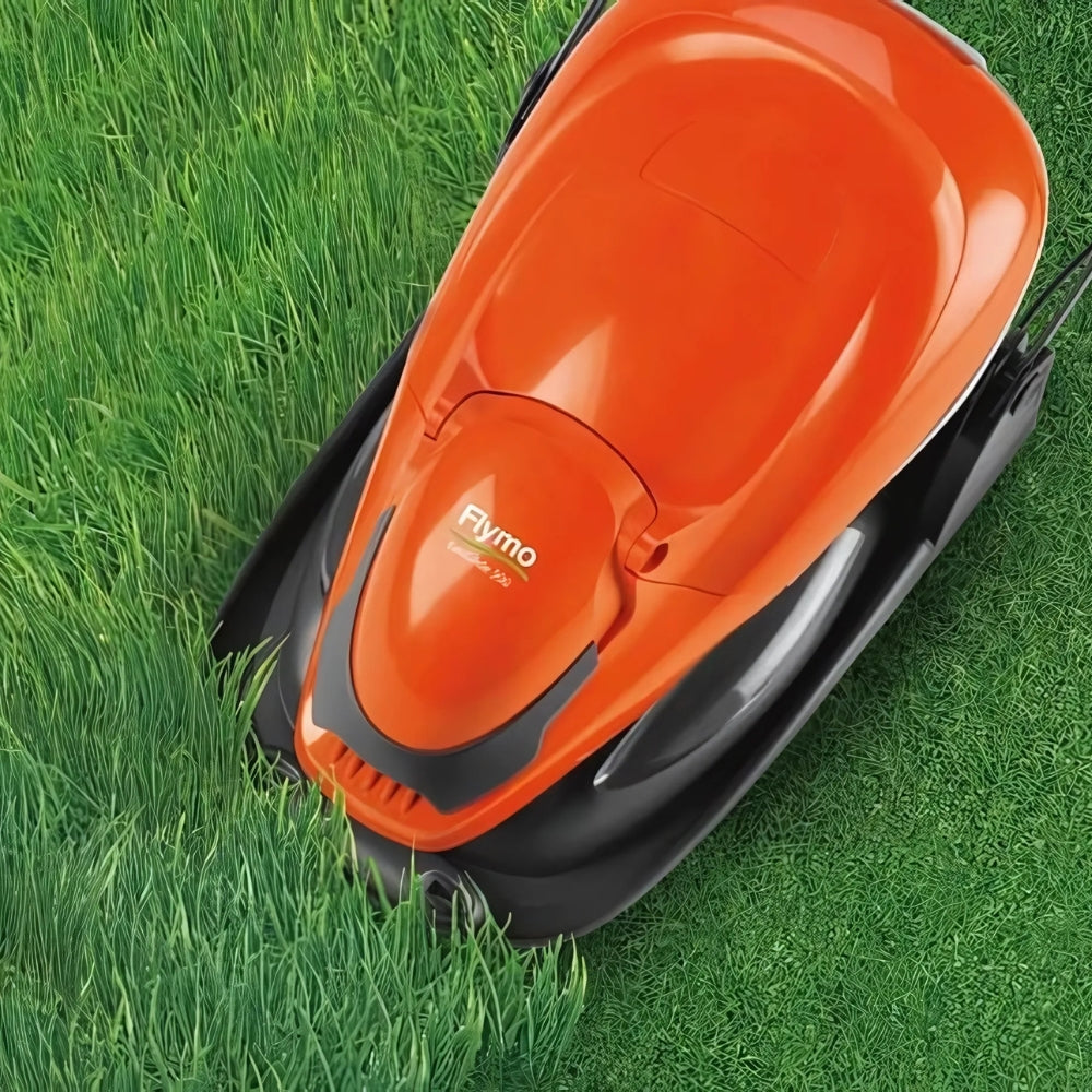 Flymo cutting lawn hovering over long grass