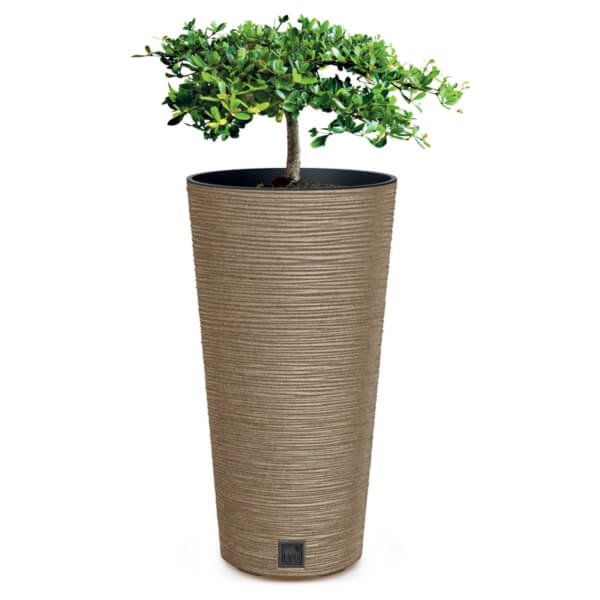 Tall natural colour plant pot with ribbed surgace and plant in it