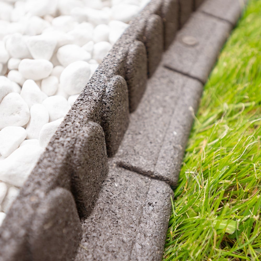 Garden border between grass and pebbles