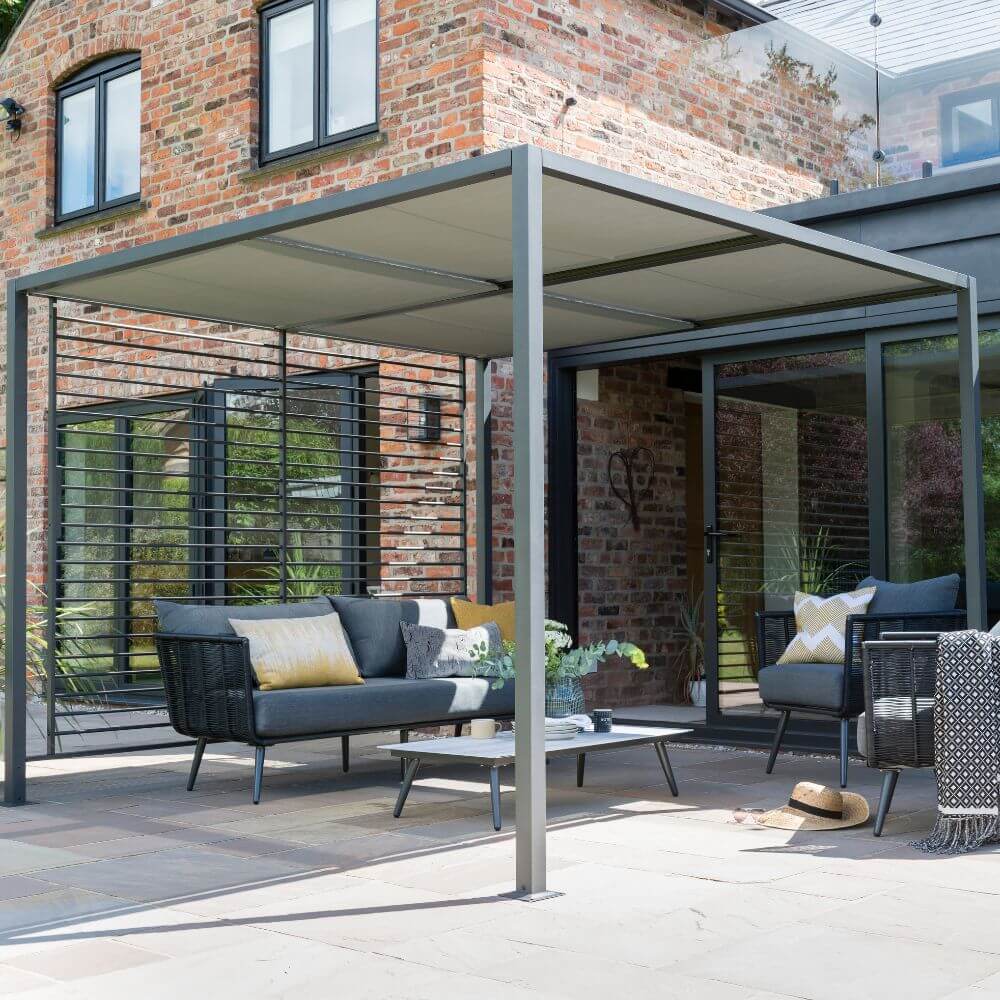 Garden Gazebo with sliding roof showing furniture and next to house