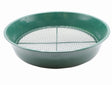 A green metal soil sieve with fine mesh used for sifting and breaking up clumps of soil.