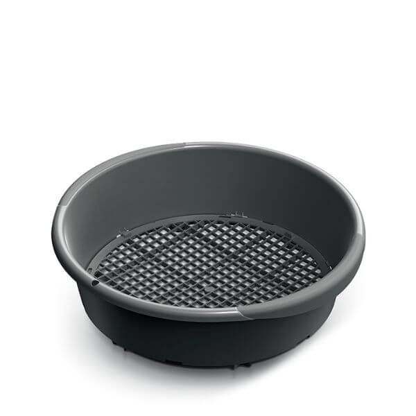 A round, black plastic garden soil sieve