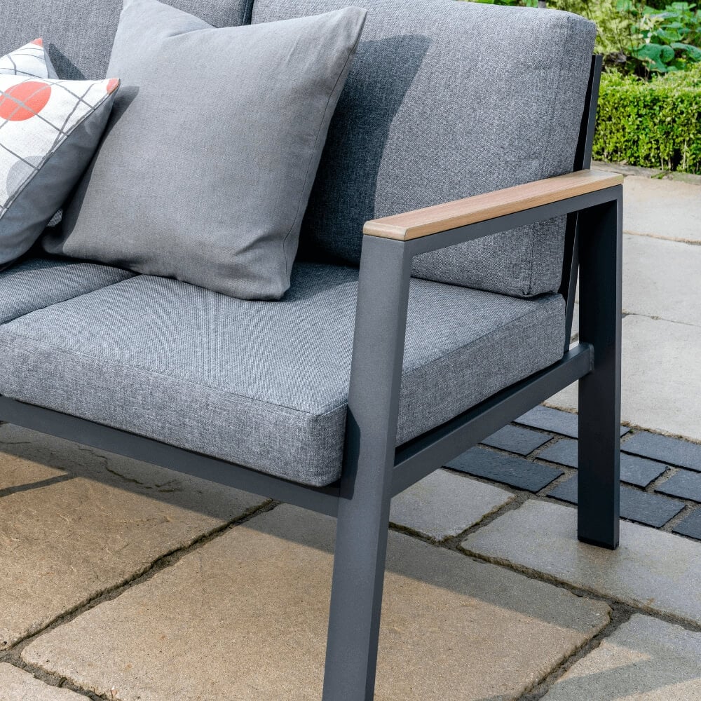 outdoor chair with cushions sat on patio in garden