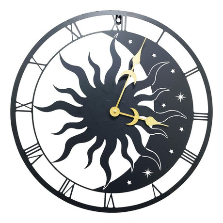A wall clock featuring a silhouette of the sun and moon