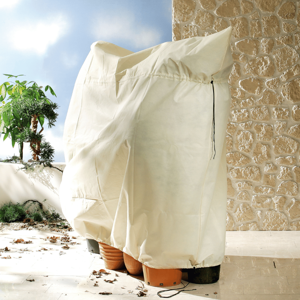 White heavy duty fleece covering plant pots