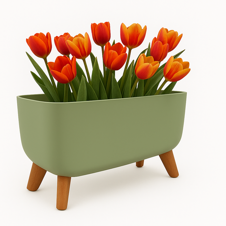 Green planter with wooden style legs holding orange tulips on a white background
