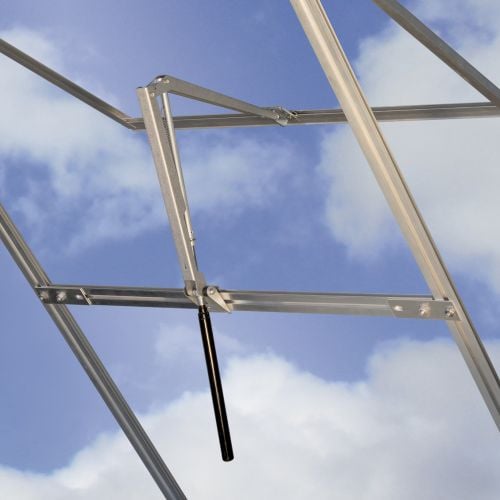 The image is looking to the sky with a greenhouse autovent opening roof window