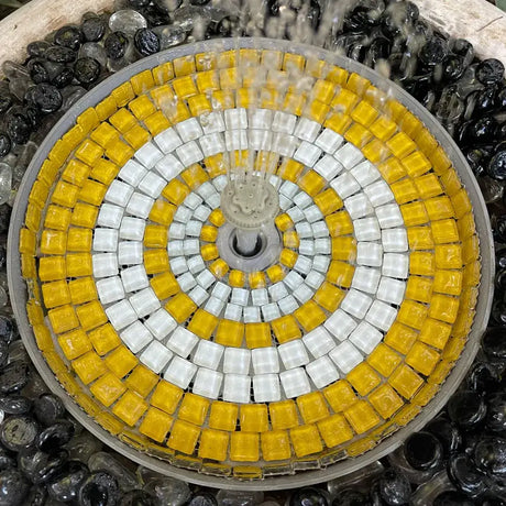 Mosaic design with yellow and white tiles on a circular pattern
