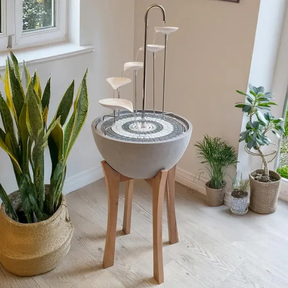 hydria wooden stand and water fountain indoors by flower pots