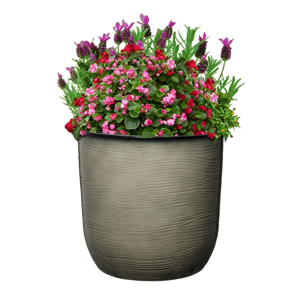 Lightweight garden plant pot with ribs light grey with flowers in it