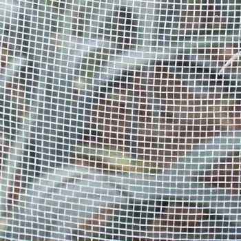 Netting cover insect mesh close up with leeks