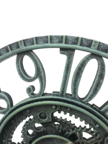 Close up of verdigris clock for the garden
