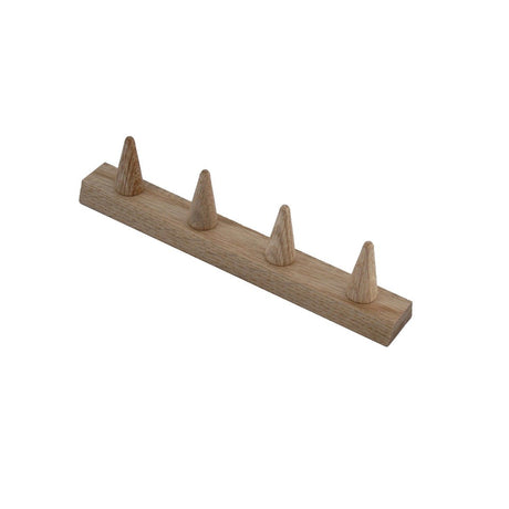 A wooden seed tray dibber with prongs spaced apart on a flat base, used for planting seeds in nursery beds.