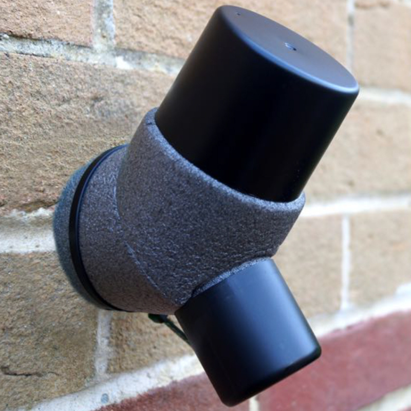 A black and gray outside tap cover  to protect the tap from freezing.